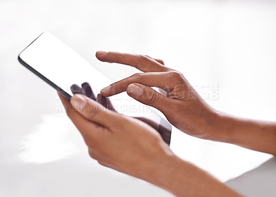 Buy stock photo Cropped shot of a person using a digital tablet