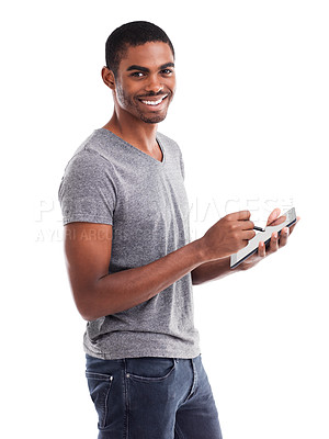 Buy stock photo Cropped shot of a young man using a digital tablet