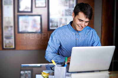 Buy stock photo Businessman, laptop and typing in workplace professional, salesman and working in office. Male person, smile and happy with computer or research, corporate and technology for connectivity or project