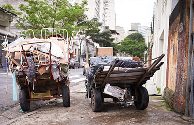 Buy stock photo Shot of carts full of garbage in the street of a poor neighbourhood