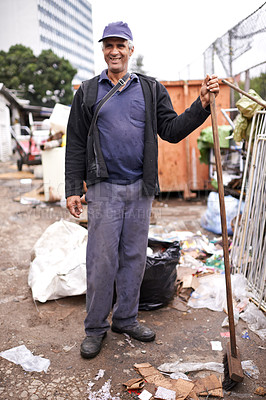 Buy stock photo Man, worker and cleaning of garbage for waste management in city with portrait, broom and happiness. Person, face and smile by dumpster site for scrap, recycling and trash in neighborhood for litter