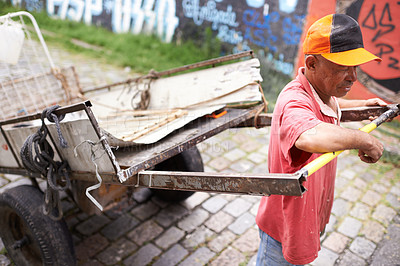 Buy stock photo Man, walking and cart for trash in street for idea, strong or collect garbage for recycling for ecology. Person, rickshaw or wheelbarrow for favela, sustainability or environment on road in Sao Paulo