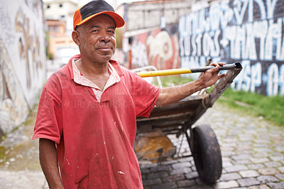 Buy stock photo Man, portrait and cart for rubbish in street for smile, walk and collect trash for recycling for ecology. Person, rickshaw or barrow for sustainability, environment and garbage on road in Sao Paulo