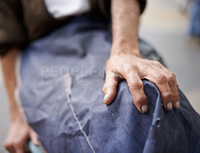 Buy stock photo Cropped shot of an elderly man wearing an apron