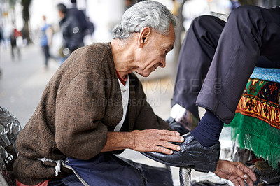 Buy stock photo Shine, shoes or old man in street, city or cleaning service for client or customer with polish or trade. Cloth, senior or feet of businessman in downtown Sao Paulo for footwear, job or outdoor help