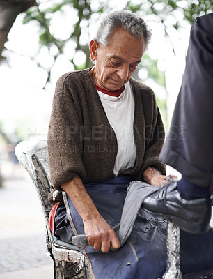 Buy stock photo Hands, senior and repairman with polishing shoes for customer in handcraft, startup business in street. Entrepreneur, shoemaker and service with client for leather footwear, skills and professional.