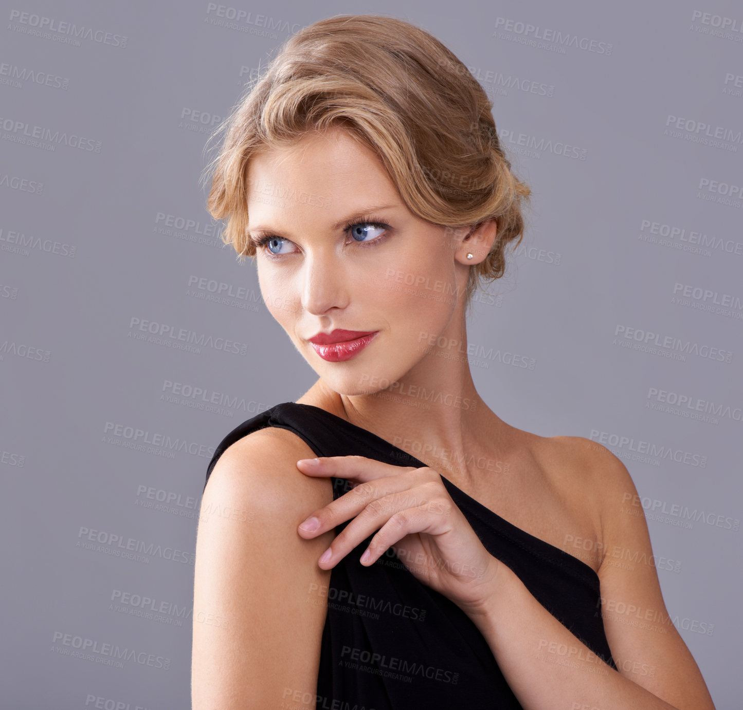 Buy stock photo A gorgeous young woman in an evening gown while isolated on a grey background