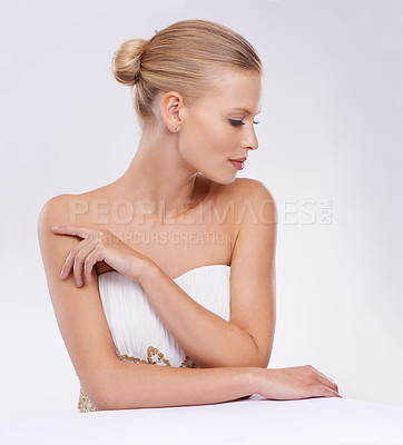 Buy stock photo A gorgeous young woman in an evening gown while isolated on white