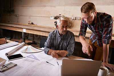 Buy stock photo An architect drawing up plans