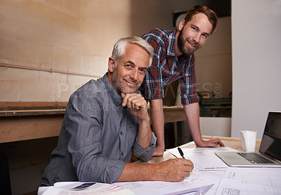 Buy stock photo Architecture, teamwork and portrait of men in workshop for collaboration on carpentry design. Senior architect, smile and father and son working on blueprint with trainee, apprentice and mentor.