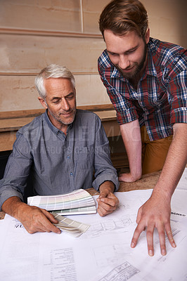 Buy stock photo Architects, collaboration and men with blueprint in office for building, construction or repairs. Engineering, design and industrial apprentice planning and working on industry project with mentor.