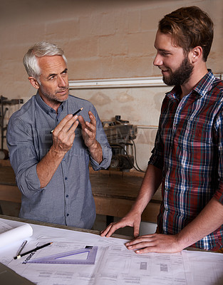 Buy stock photo Architecture team, working on blueprint in workshop, designer and engineering collaboration. Senior mentor, male training architect and work together on remodeling project with floor plan paperwork