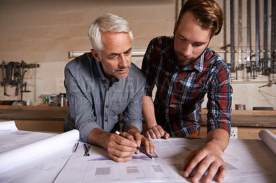 Buy stock photo Architect team, working on blueprint in workshop and designer for engineering collaboration. Senior in architecture with male trainee, work on remodeling project with floor plan paperwork and drawing