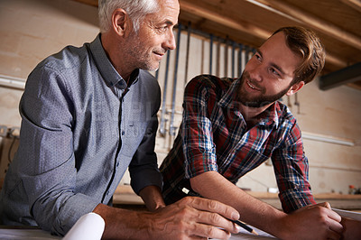 Buy stock photo Happy, father and son in a workshop, architect or renovation with drawing or conversation. Parent, men or teamwork with construction or building with planning for project or industry with cooperation