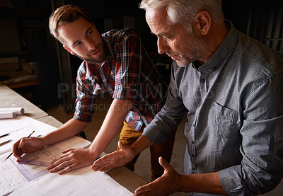 Buy stock photo Carpenter, team and men with blueprint for discussion of construction project or father teaching son. Engineer, apprentice and senior mentor with design, drawing and planning for training at workshop