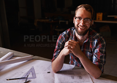 Buy stock photo Portrait, confident and architect with paperwork in workshop with smile for career in construction industry. Man, contractor and entrepreneur of startup, small business and design for planning