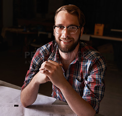 Buy stock photo Portrait, man and architect with documents in workshop on wooden table for paperwork of startup. Confident, entrepreneur and male person with smile for small business in industry for construction