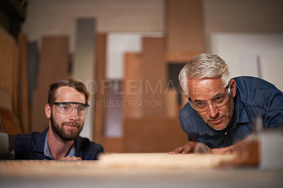 Buy stock photo Wood, father and son in workshop, teamwork or renovation with drawing or safety glasses with planning for project. Parent, men or teamwork with construction or building with problem solving or choice
