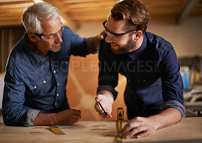 Buy stock photo Architecture, teamwork and senior mentoring man in workplace of workshop, pencil and drawing. Male people, professional and working with measuring tape on wooden table for planning of renovation