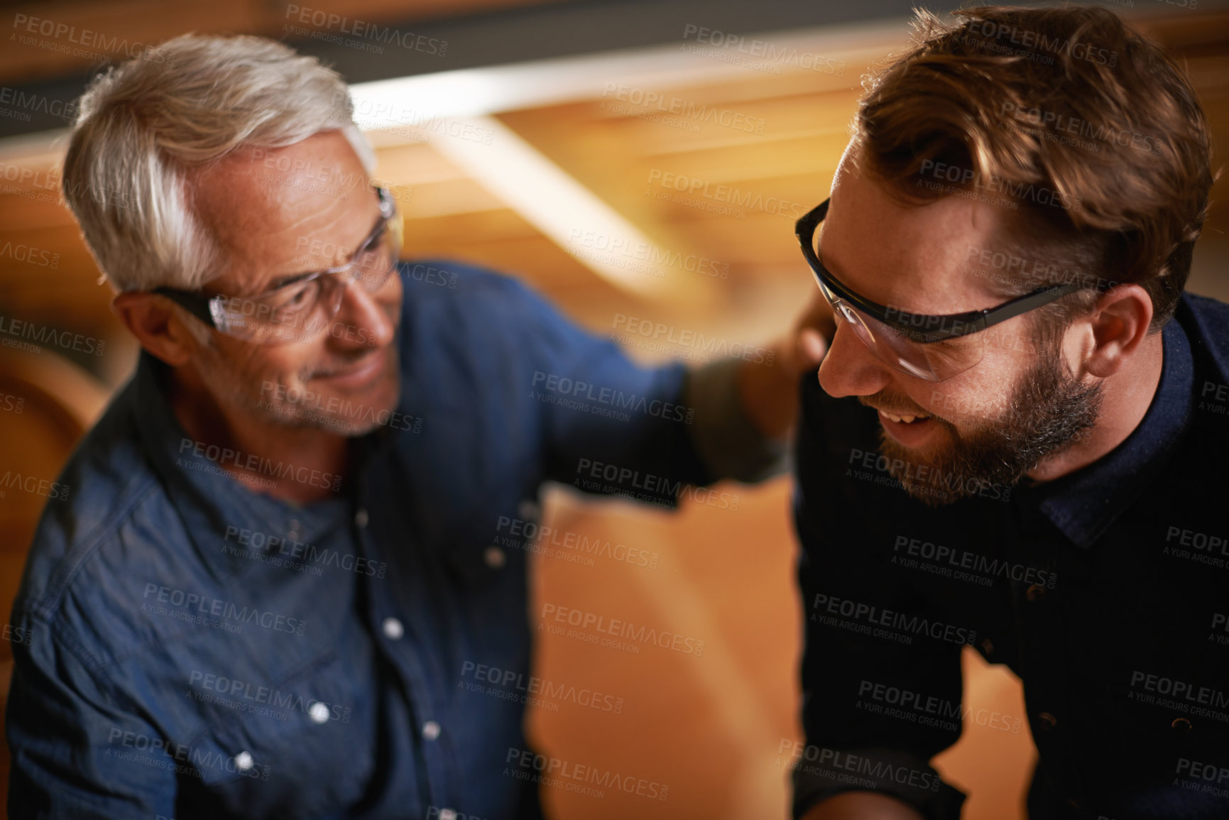 Buy stock photo Support, father and son in a workshop, architect and family with renovation and safety glasses. Parent, men and teamwork with construction job and building with planning for project and cooperation