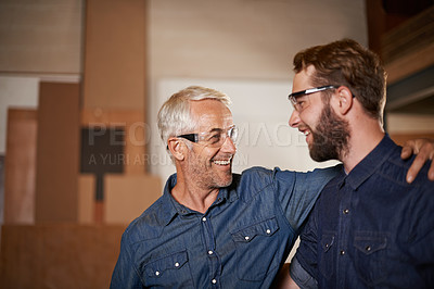 Buy stock photo Man, hug and smile with wood, workshop and family business or apprenticeship. Mature father, son and embrace with artisan, carpentry and together for startup and mentor or learning with happiness