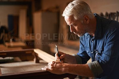 Buy stock photo Cropped shot of a mature carpenter working hard