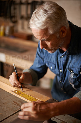 Buy stock photo Carpentry, woodwork and man with pencil, ruler and designer furniture manufacturing workshop. Creativity, small business and focus, professional carpenter planning sustainable wood project design.