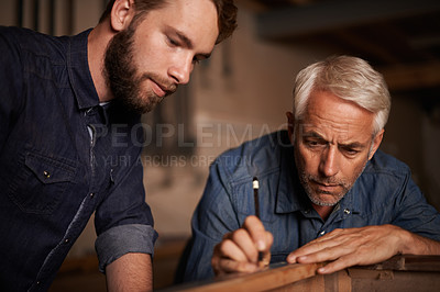 Buy stock photo Training, learning and carpenter with apprentice, helping with woodwork in professional furniture manufacturing workshop. Expert mentorship, carpentry and teamwork for men at sustainable business.