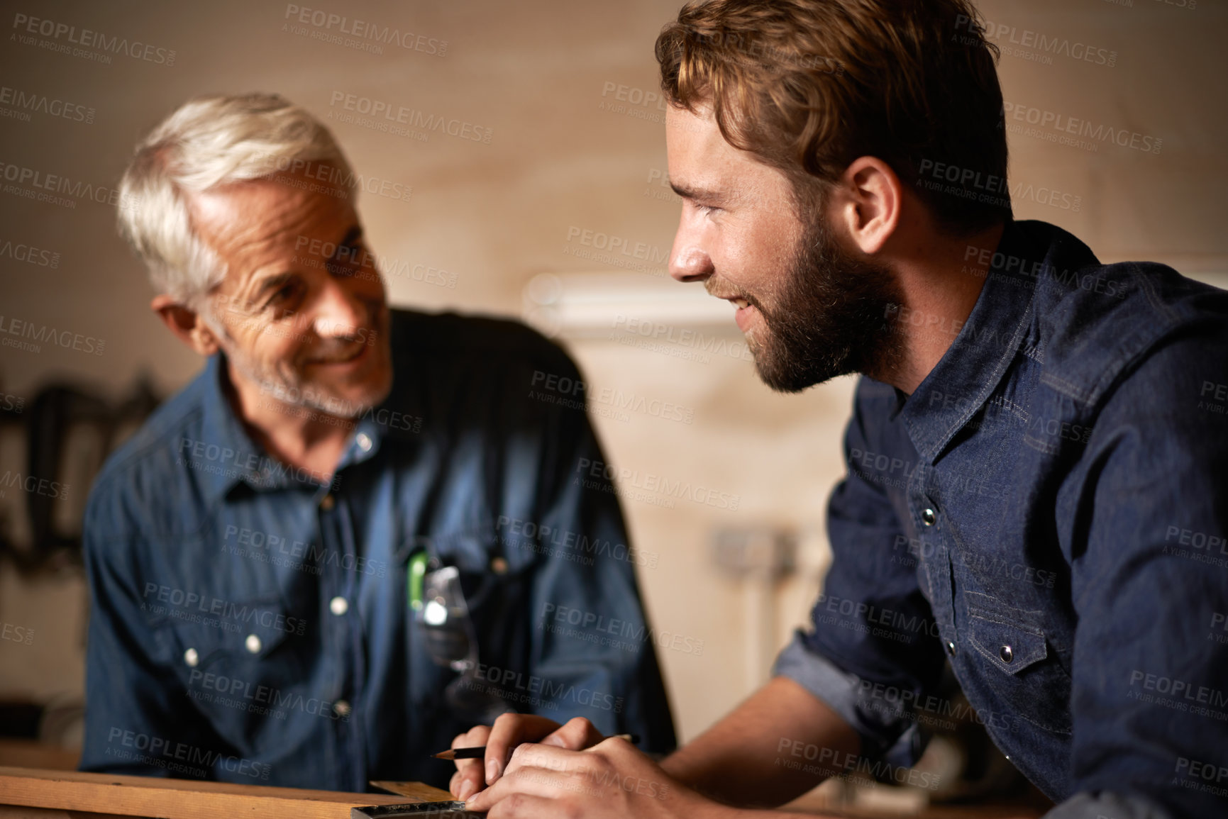 Buy stock photo Man, job and smile with wood, workshop and family business or apprenticeship. Father, adult son and design with artisan, carpentry and together for startup and mentor or learning with happiness