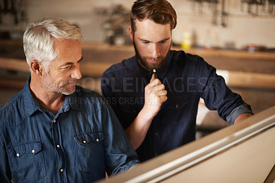 Buy stock photo Planning, discussion and architects by board in workshop for industrial carpentry project. Brainstorming, engineering and male industry apprentice working on ideas with mentor in office on site.