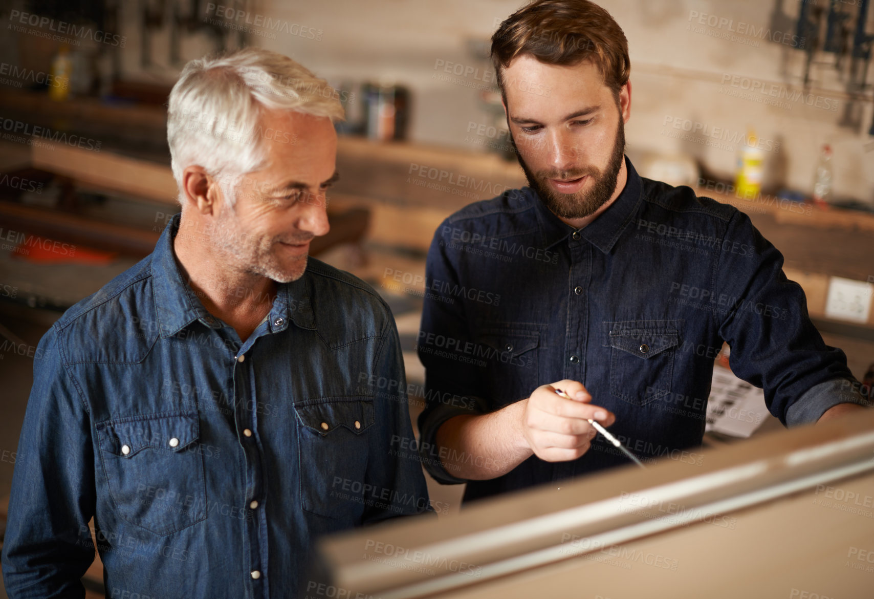 Buy stock photo Brainstorming, discussion and architects by board in workshop for industrial carpentry project. Planning, engineering and male industry apprentice working on ideas with mentor in office on site.