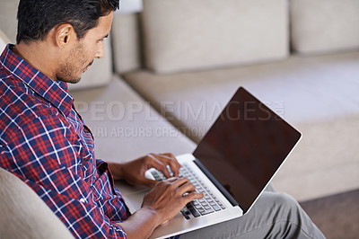 Buy stock photo Shot of a handsome young man relaxing at home
