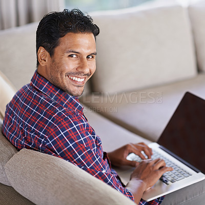 Buy stock photo Businessman, portrait and laptop on sofa or living room, working and busy in couch. Freelancer, career and male person in lounge with computer for typing, technology and connectivity at home or house