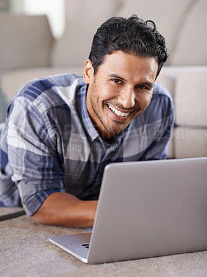 Buy stock photo Man, freelancer and internet for laptop in portrait of living room, research and scroll or browse on website. Happy male person, floor and online for information or home for app, remote work and plan