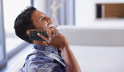 Buy stock photo Man, smartphone and laugh on sofa for phone call, funny conversation and communication in living room. Indian person, relax and technology in apartment for discussion, joke and mobile contact