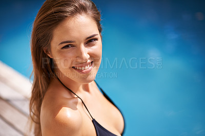 Buy stock photo Happy, portrait and woman relax on vacation at swimming pool and smile on deck with happiness at hotel. Summer, holiday and girl outdoor at resort in sunshine, water and sitting on poolside tanning