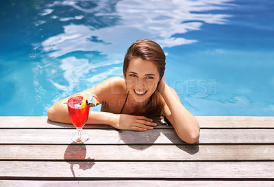 Buy stock photo Portrait of an attractive young woman sitting in a pool drinking a cocktail