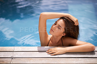 Buy stock photo Calm, woman and relax in swimming pool on vacation and rest on deck with peace at hotel or home. Summer, holiday and girl outdoor at resort in sunshine, water and leaning on poolside with beauty