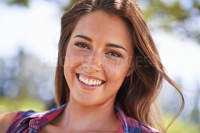 Buy stock photo A beautiful young woman smiling outdoors