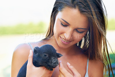 Buy stock photo Face, smile and woman with piglet on farm for agriculture or sustainability outdoor in Texas. Love, pet or summer and happy young person with baby pig in nature for livestock caring or nurture
