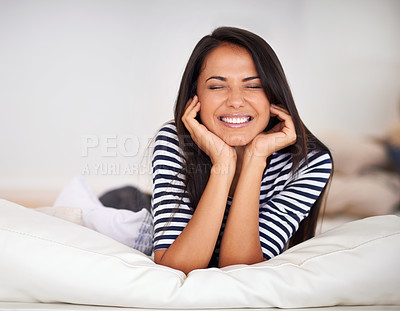 Buy stock photo Happy, relax and woman on sofa in living room with positive, pride or confident attitude. Smile, calm and beautiful young female person resting on couch in lounge on weekend in modern apartment.