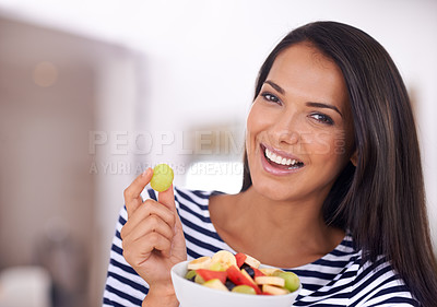 Buy stock photo Portrait of a beautiful young woman holding her fruit salad