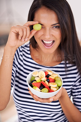 Buy stock photo Playful, woman and fruit salad with smile, natural nutrition and healthy organic food. Happy, female person with snack with vitamins for skin and body wellness, balance diet and excited vegan choice