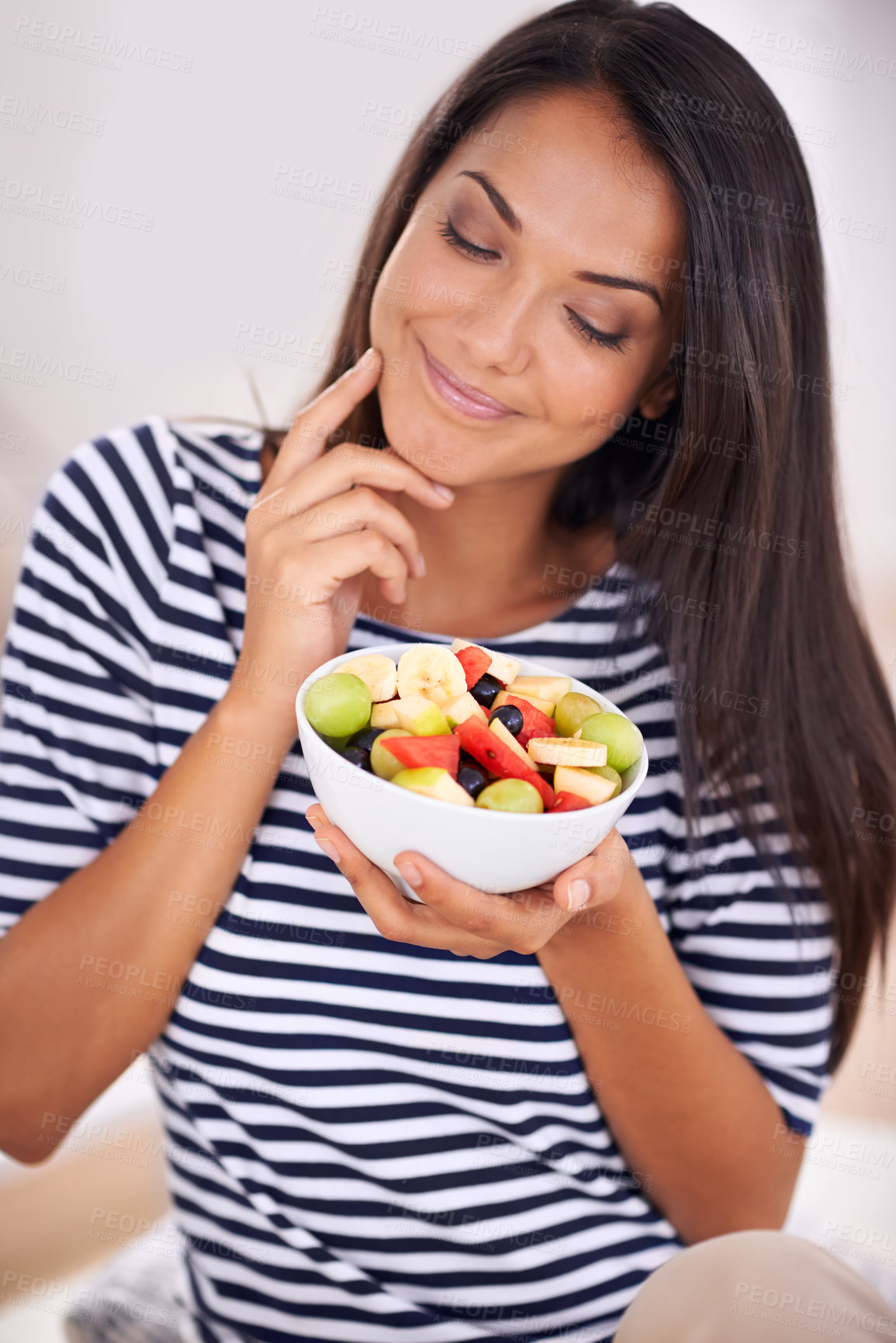 Buy stock photo Woman, smile and fruit bowl and thinking, natural nutrition and healthy organic food. Happy, female person with snack with vitamins for skin and body wellness, balance diet or excited vegan choice