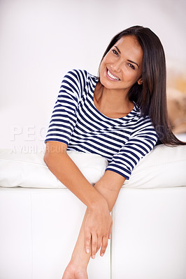 Buy stock photo Closeup of a young woman leaning on her couch