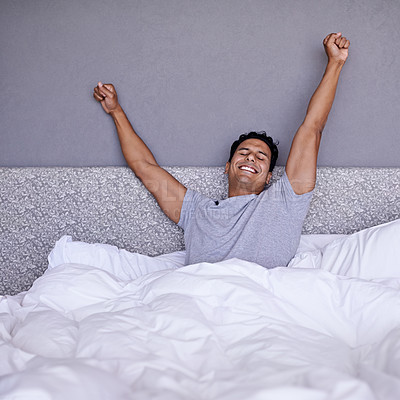 Buy stock photo Wake up, man and stretching in bed in morning, positive and relax on mattress for lazy weekend. Happy person, rest and health in bedroom with energy, fresh and wellness in cozy duvet in modern home