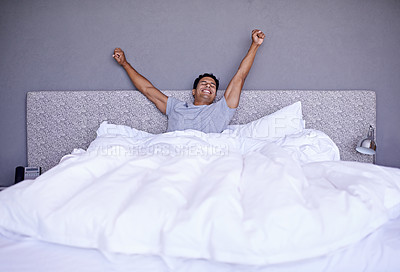 Buy stock photo A young man stretching out while waking