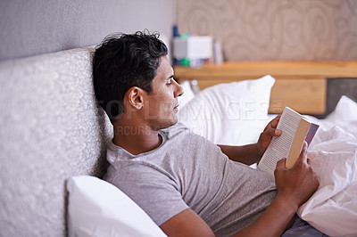Buy stock photo Man, rest and reading a book in bedroom, calm and adventure in action novel on break in morning. Person, learning and inspiration in self help manual, creativity and relax in warm blanket on vacation
