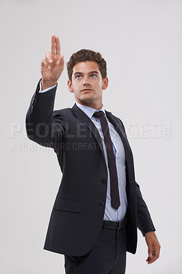 Buy stock photo Entrepreneur, man and click a digital interface in studio on white background for company research and ideas. Business, male person and touch with user experience for information and innovation 