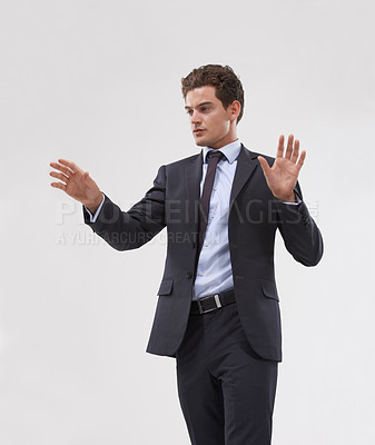 Buy stock photo Future, interface and touchscreen with businessman user in studio on white background for metaverse access. Corporate, digital transformation and software with young employee in suit for networking